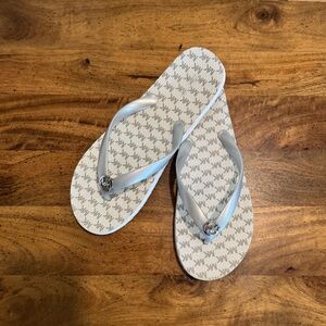 Michael Kors Silver and White Flip Flops with Silver MK logo. Size 10